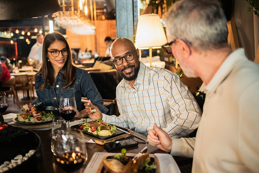 a group of people sitting at a table