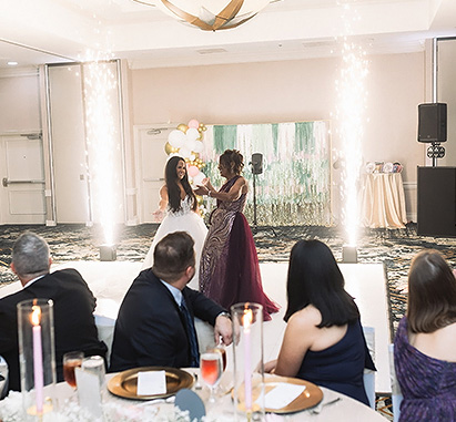 a group of people in formal attire dancing