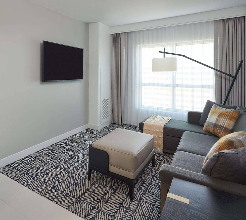 a living room with a couch and a tv