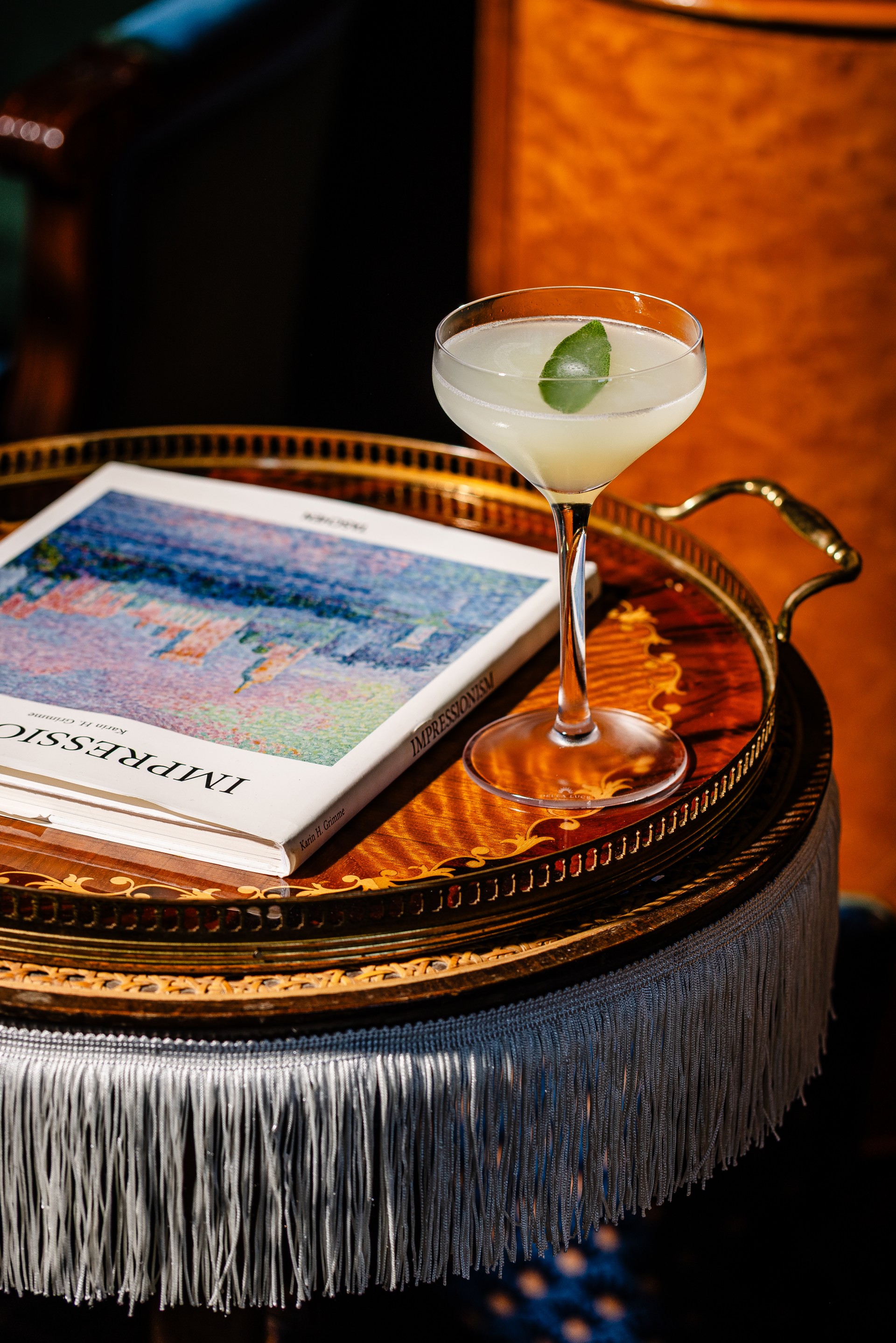 a glass of liquid on a table