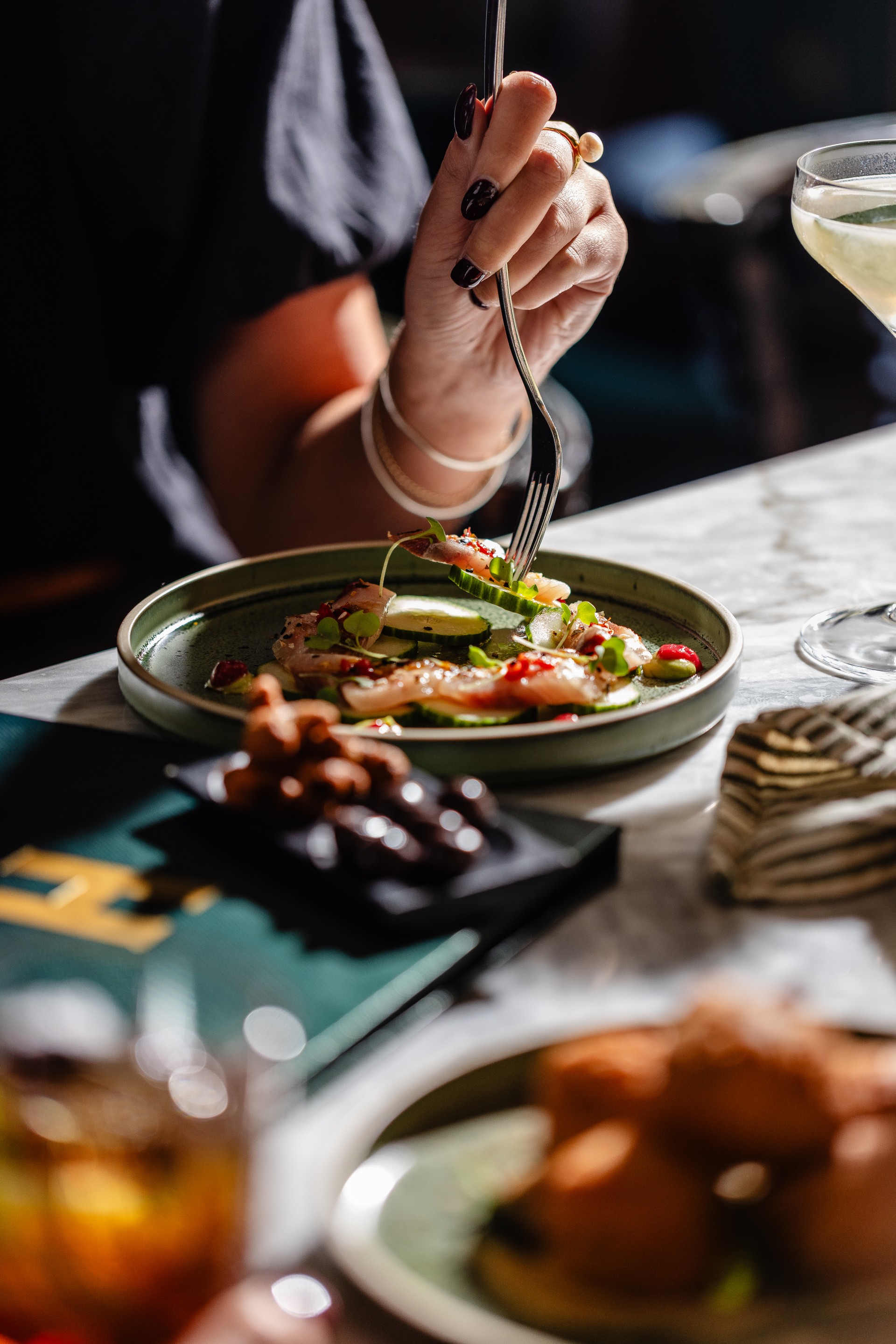 a person eating food on a plate
