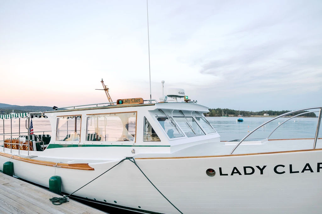 a white boat on a dock