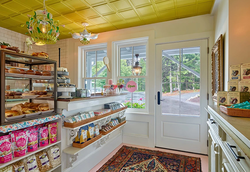 a bakery with a rug and a door