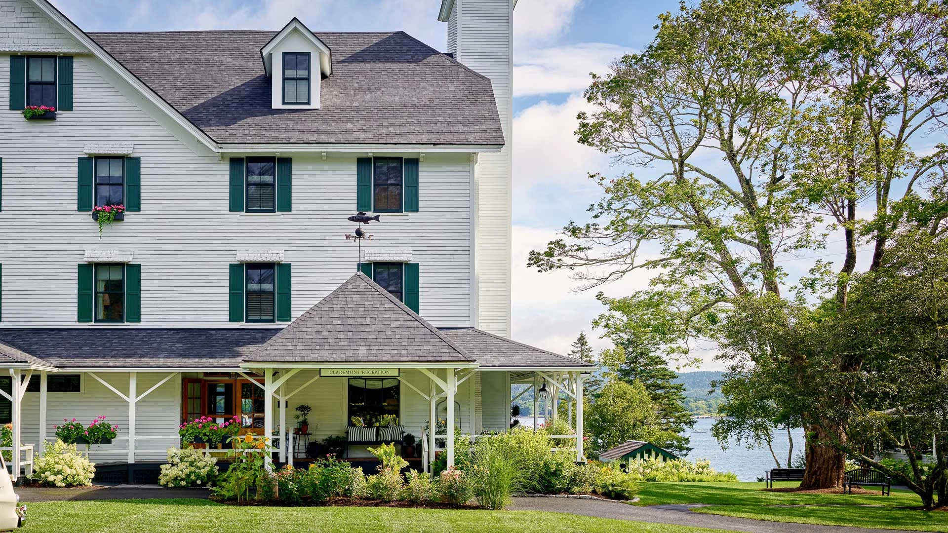 a house with a large porch and a large tree