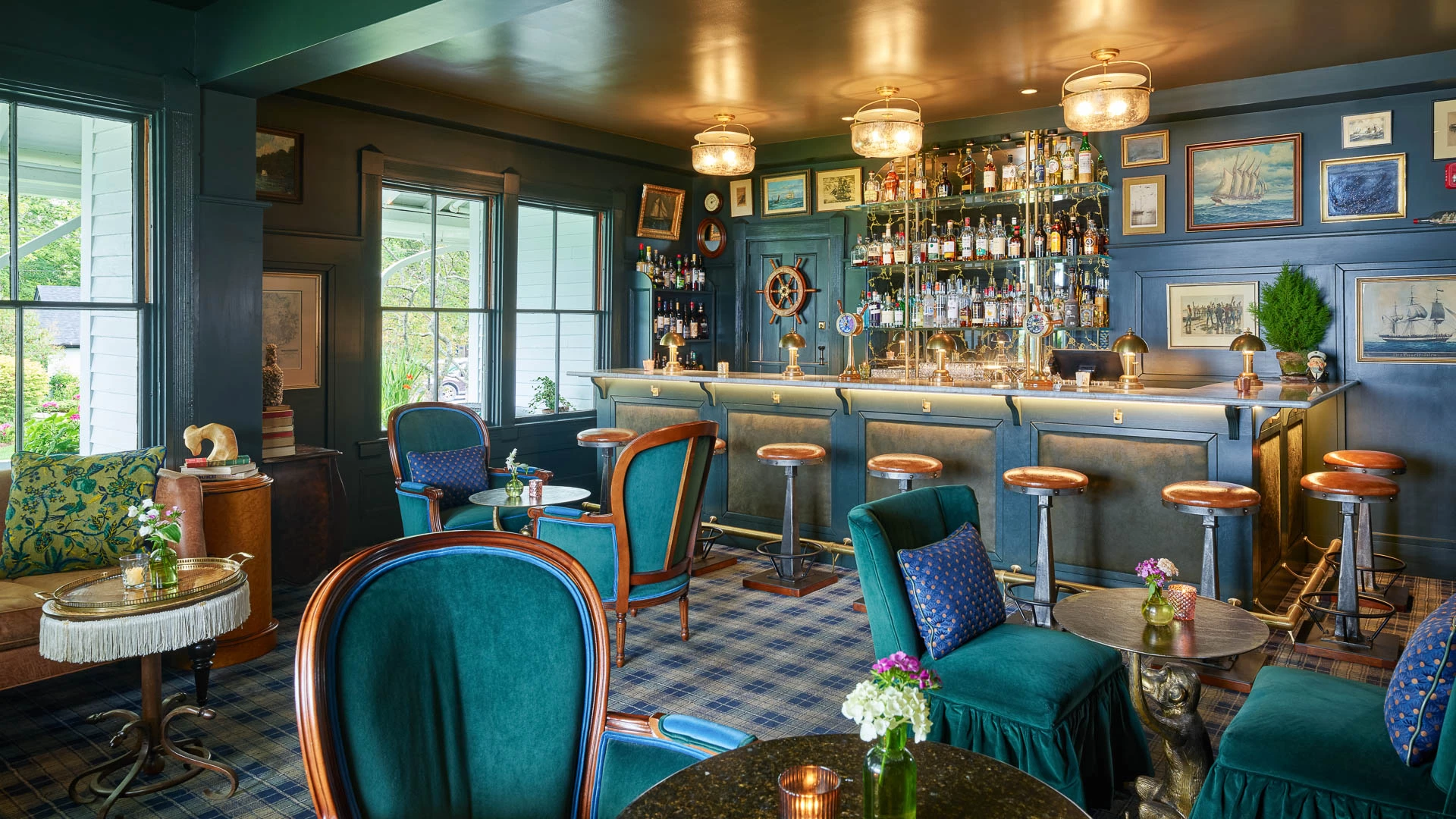 a bar with a green chair and a table