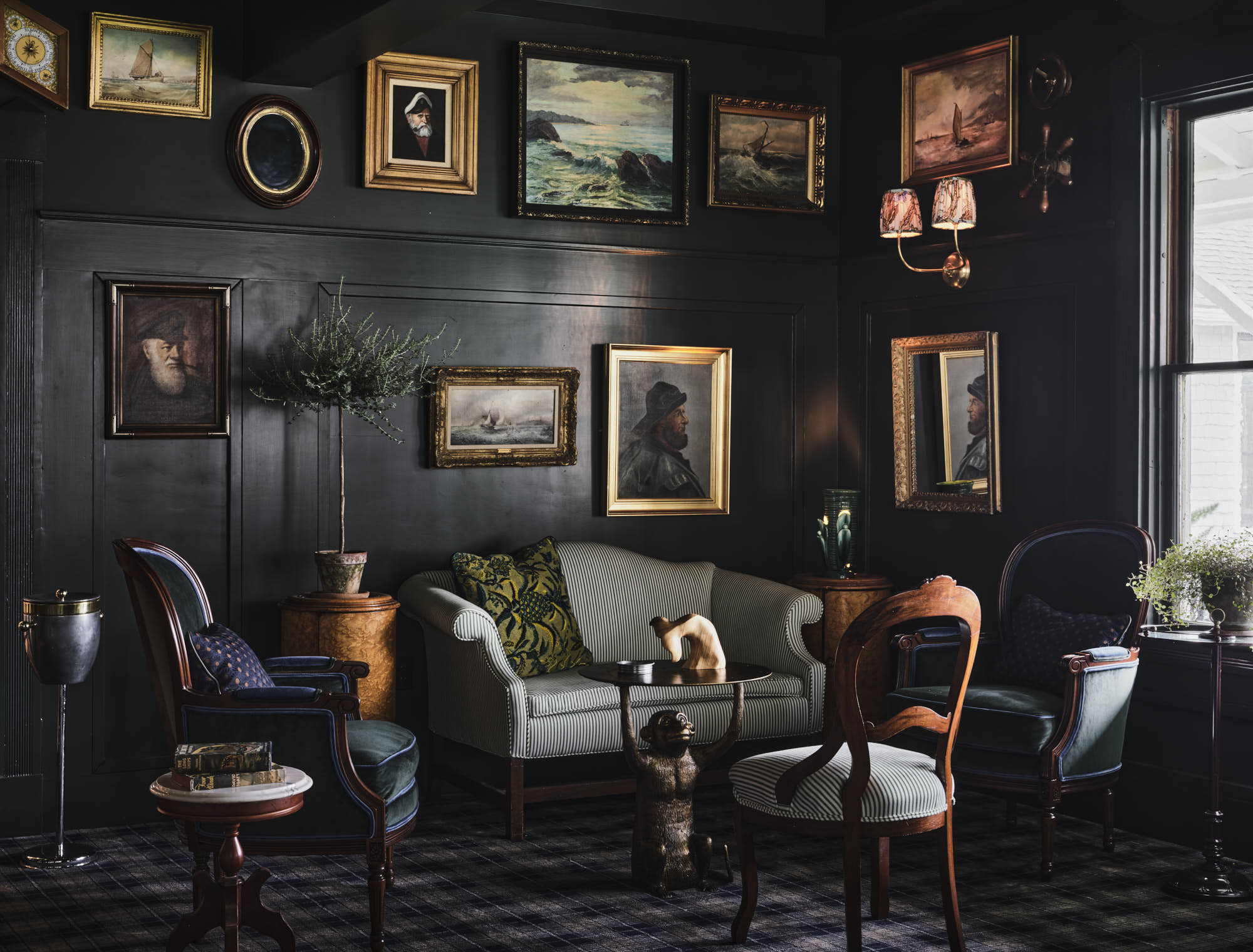 a room with a couch and chairs