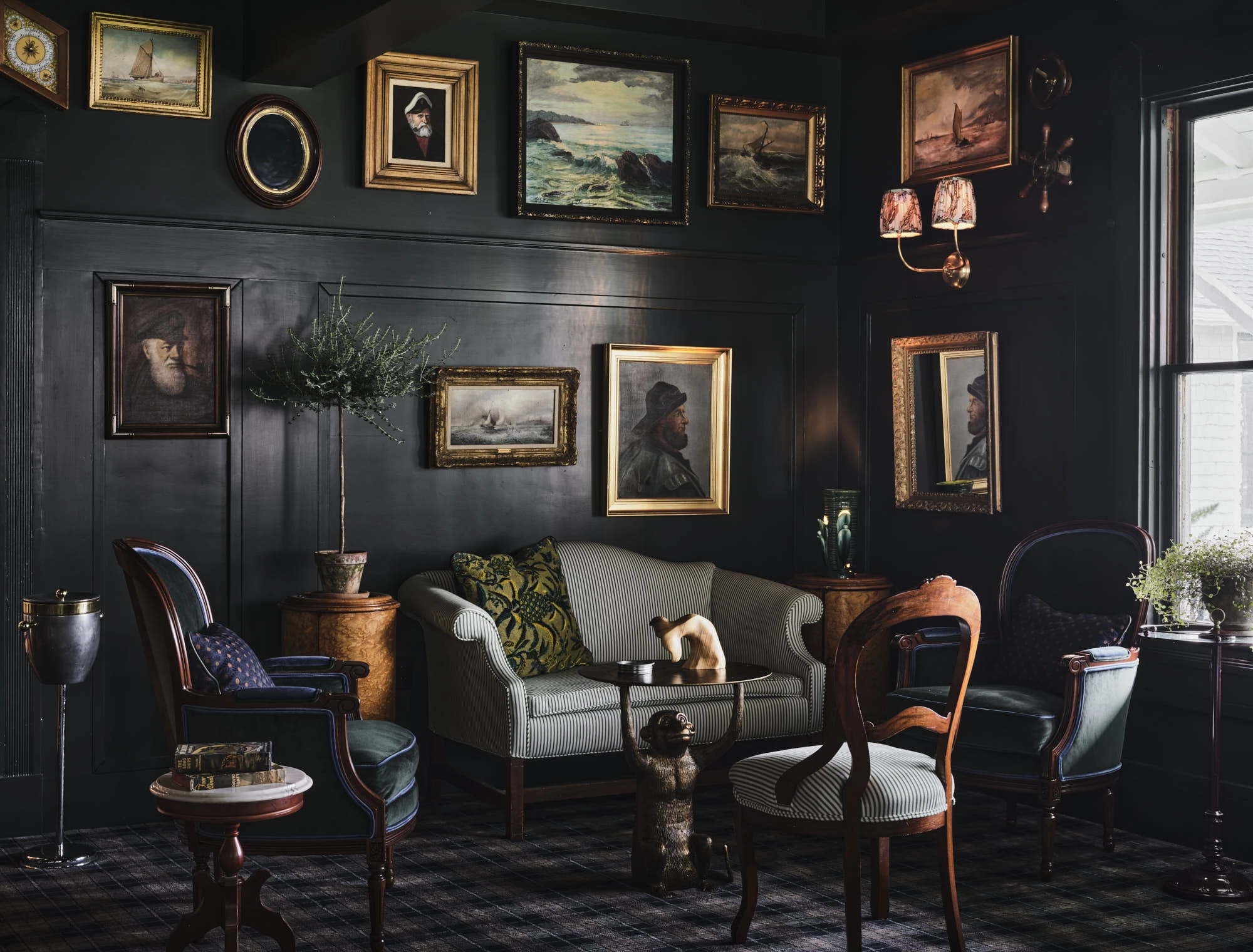 a room with a couch and chairs