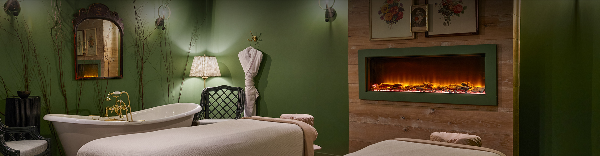 a room with a bed and a fireplace