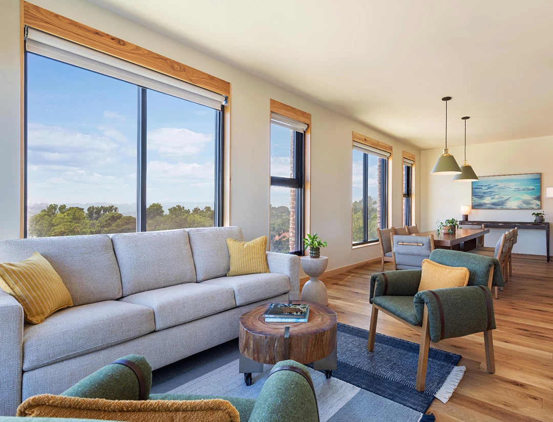 a living room with couches and chairs