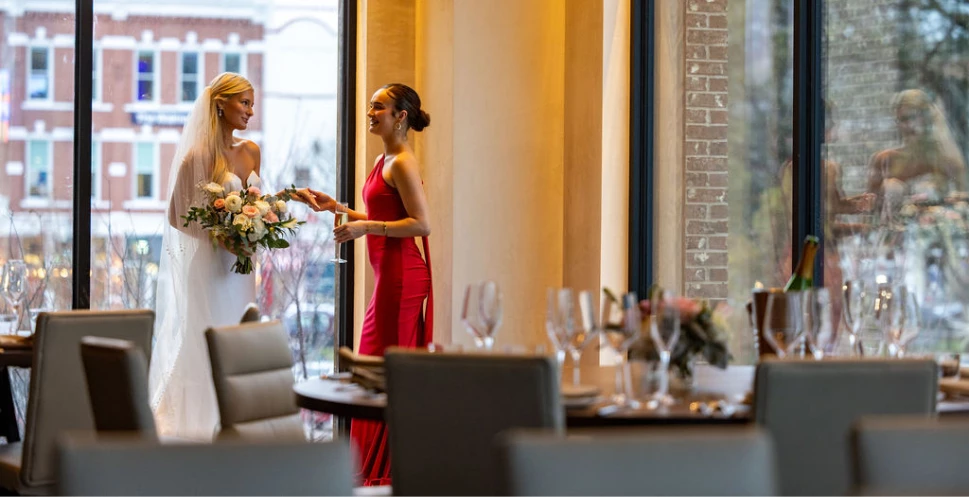 a woman in red dress holding a bouquet of flowers
