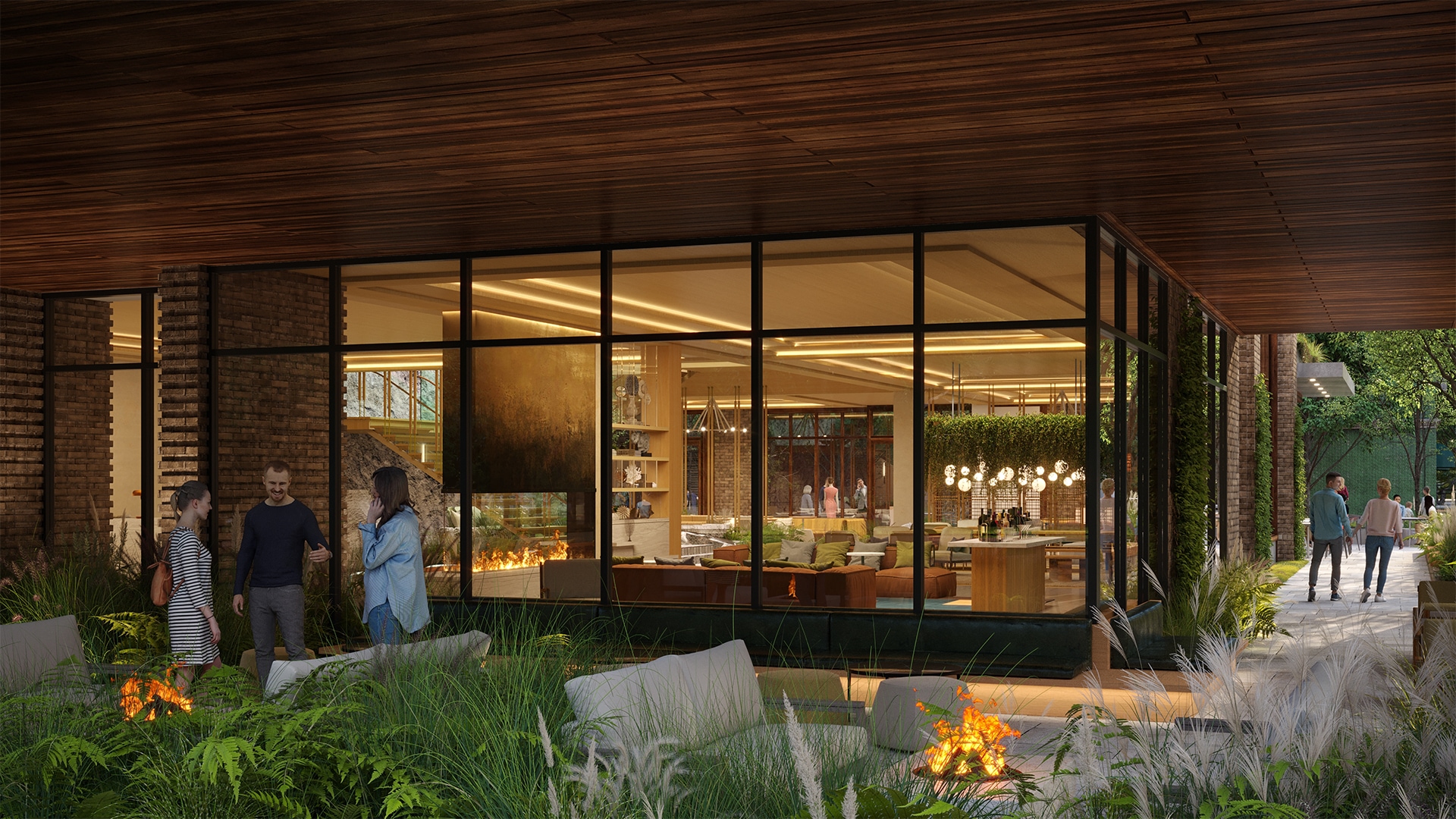 a building with glass windows and a fire pit