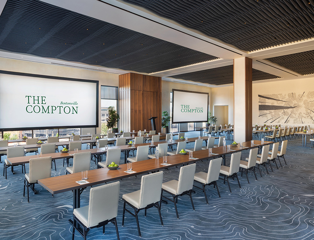 a large room with long tables and chairs