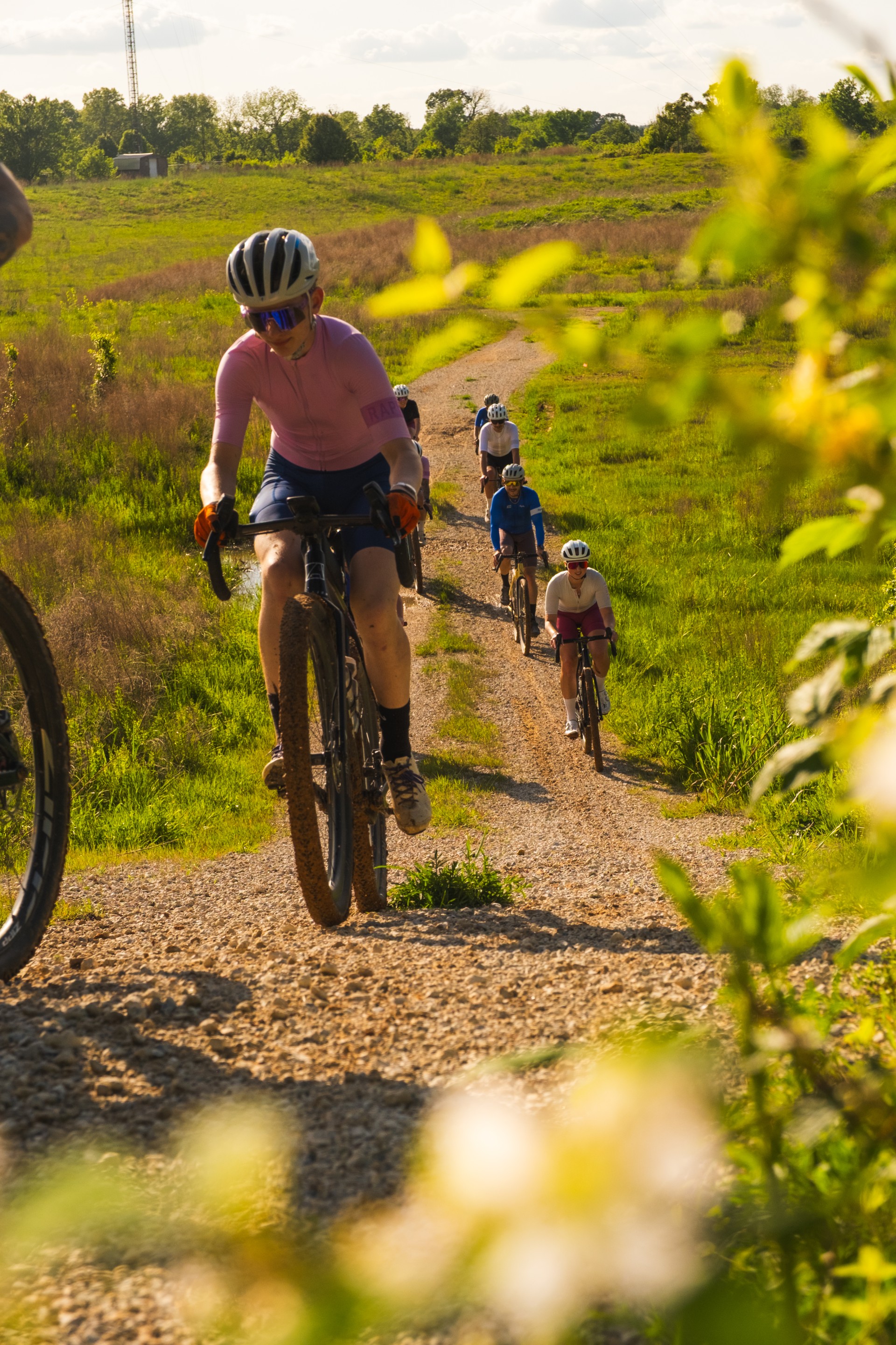 a group of people riding bikes on a trail