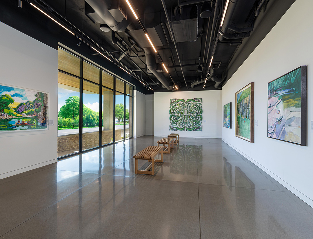 a room with benches and paintings on the wall