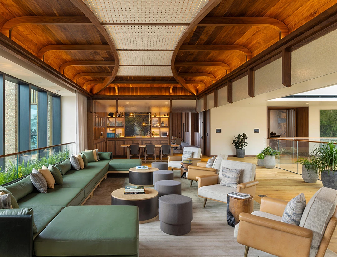 a large room with a large couch and chairs