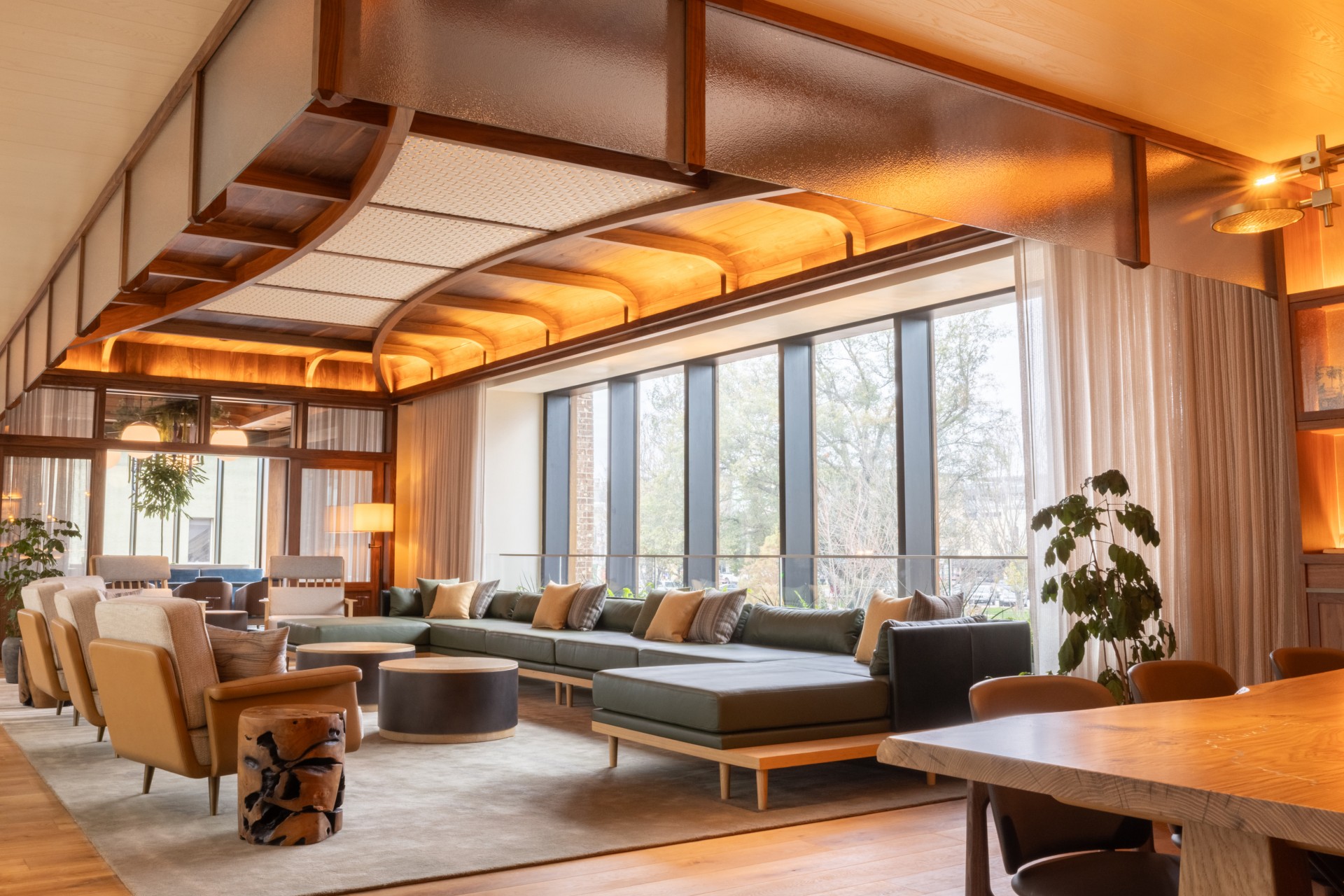 a room with a large couch and tables