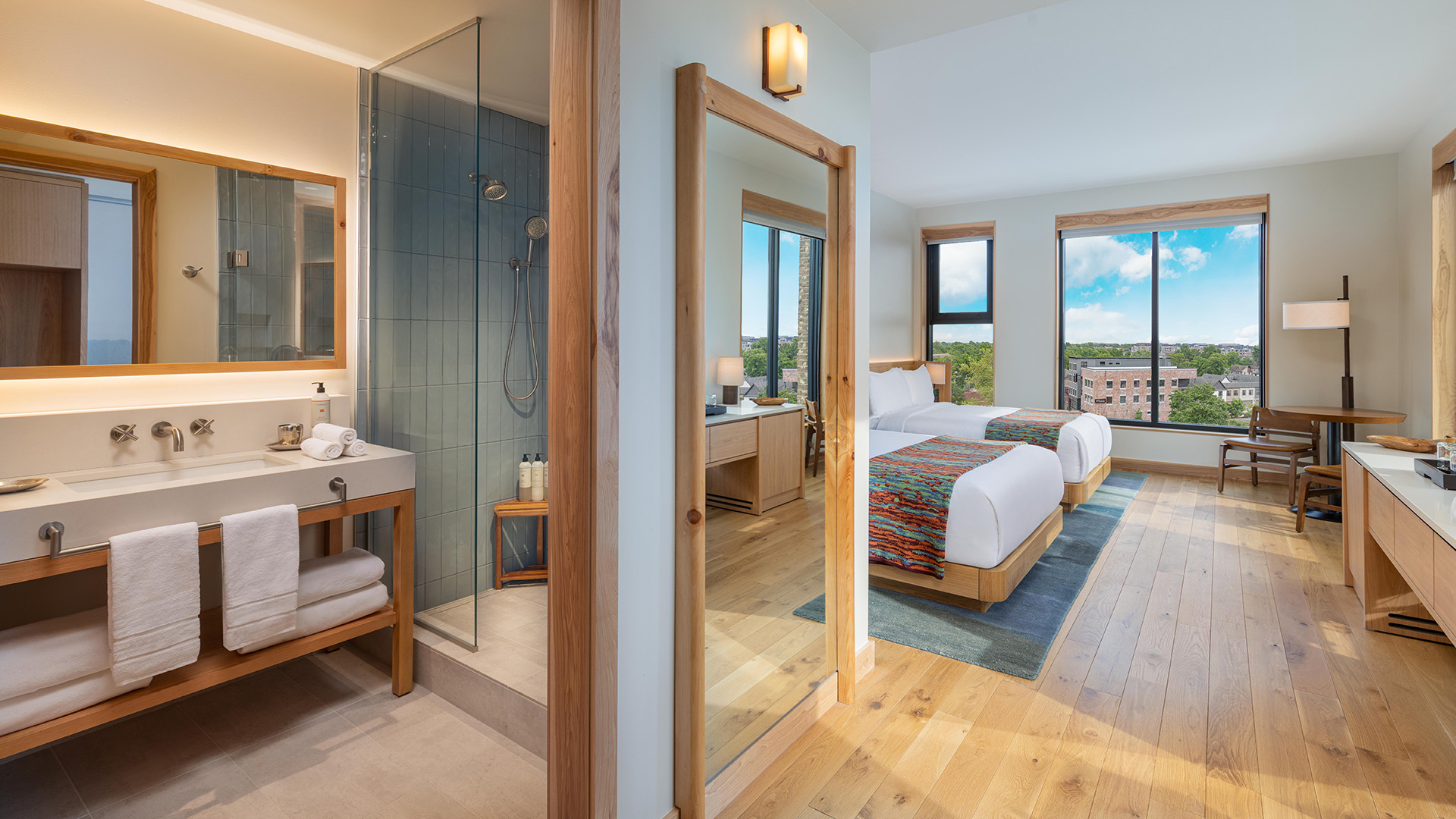 a room with two beds and a shower