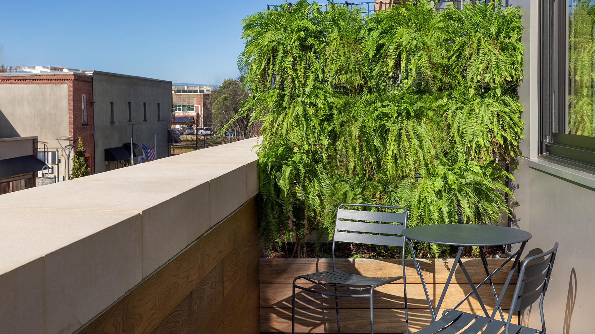 a chair and table on a balcony