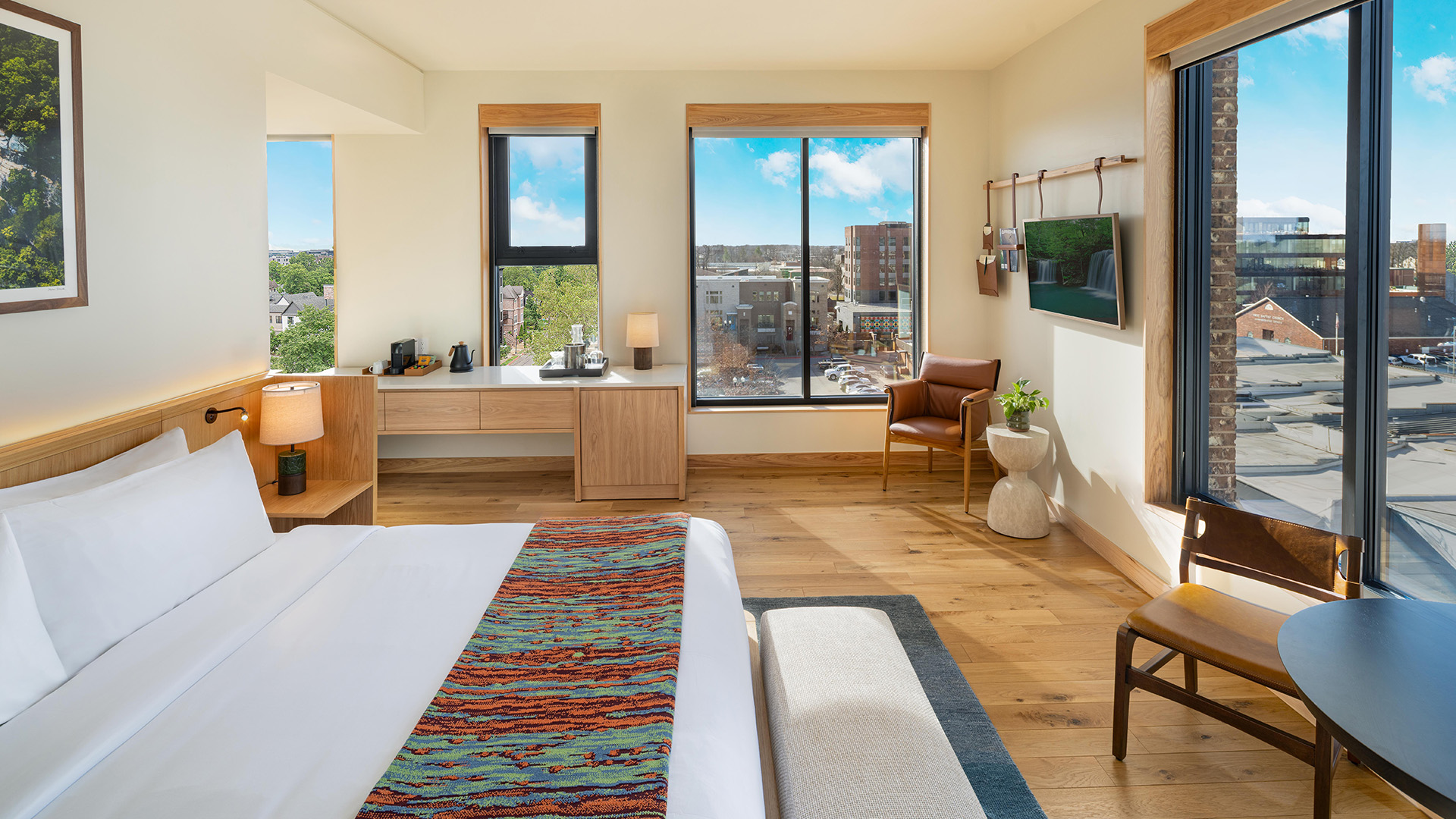 a room with a bed and a television