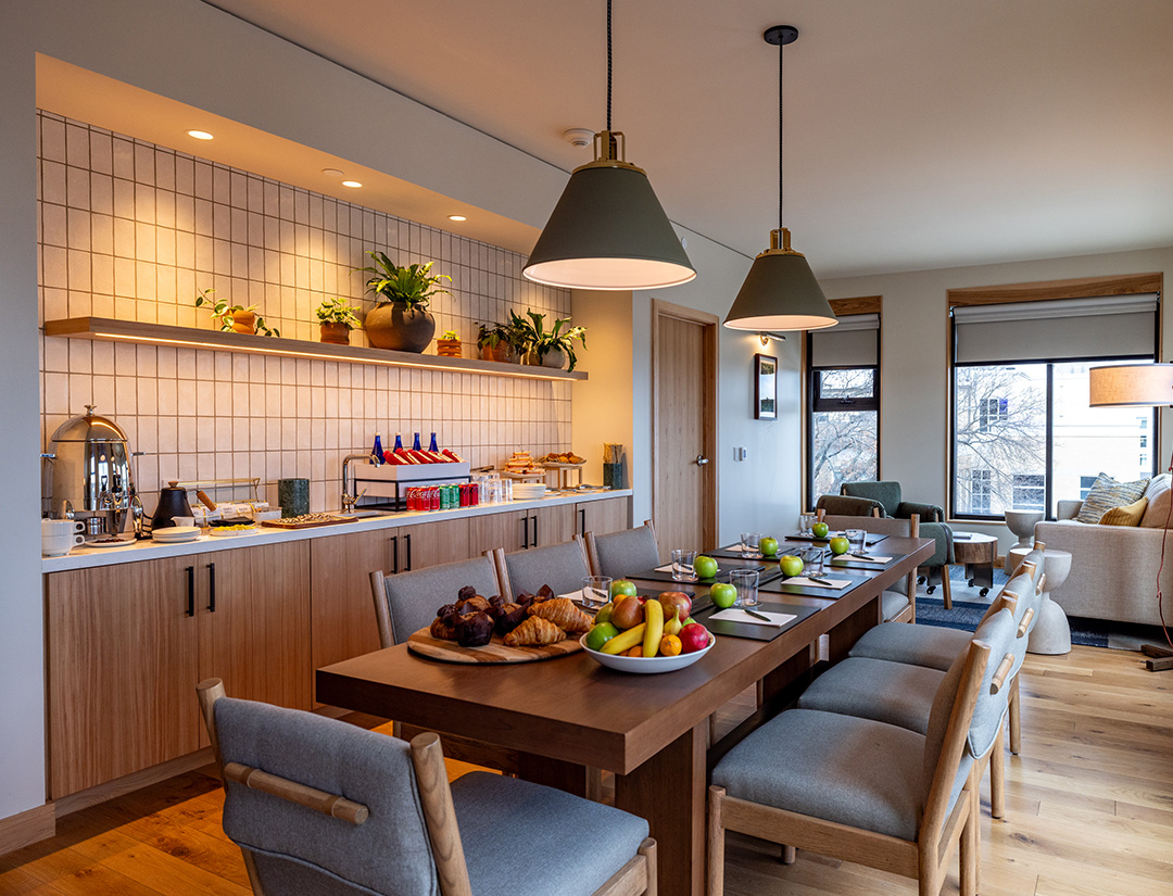 a dining room with a table and chairs