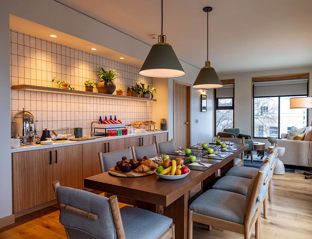 a dining room with a table and chairs