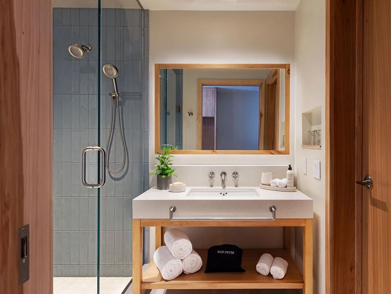 a bathroom with a shower and a sink