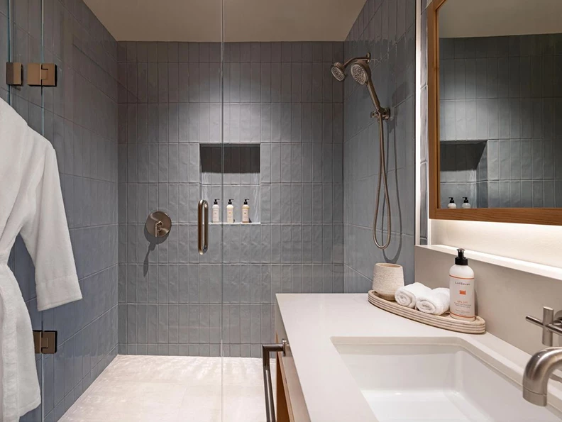 a bathroom with a shower and sink