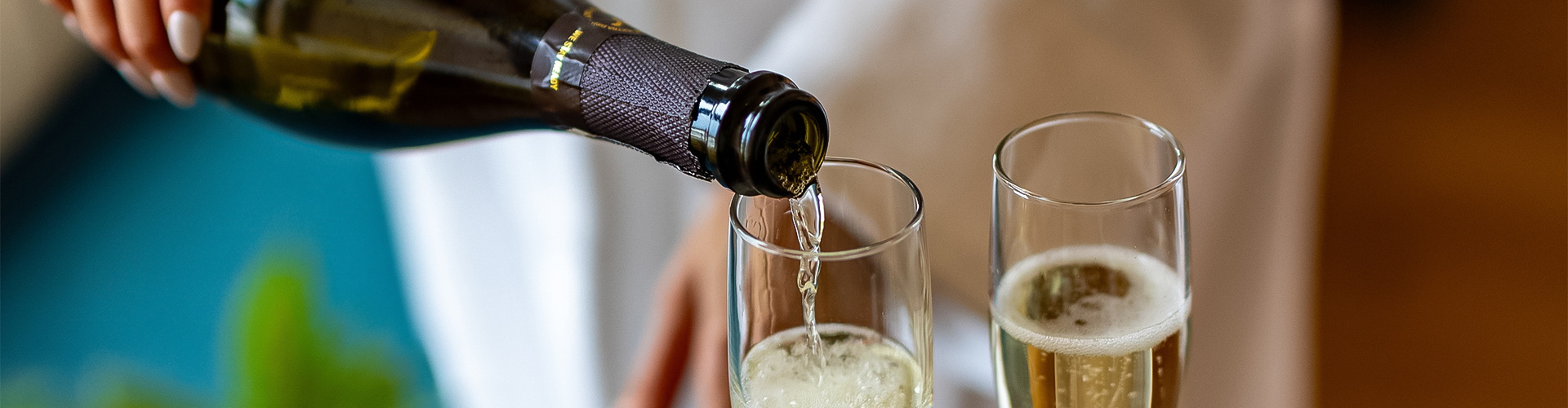 a bottle of champagne being poured into a glass