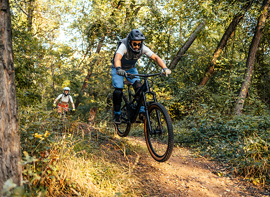 a man riding a bike on a trail