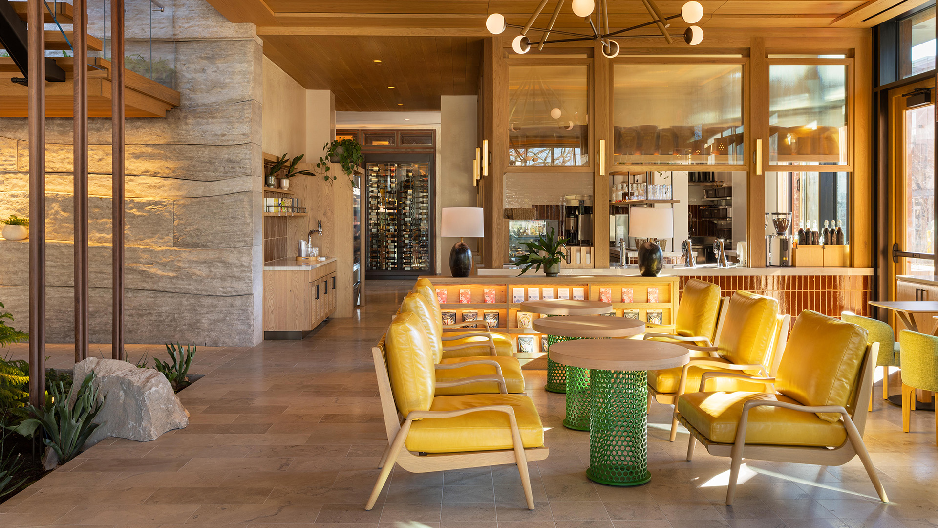 a room with yellow chairs and tables