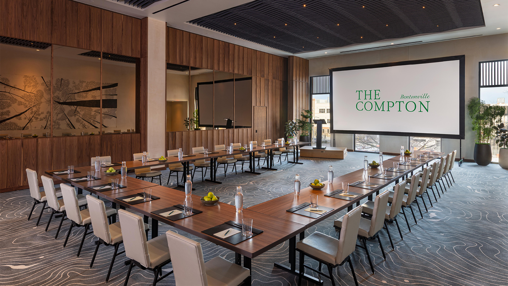 a large conference room with a large screen