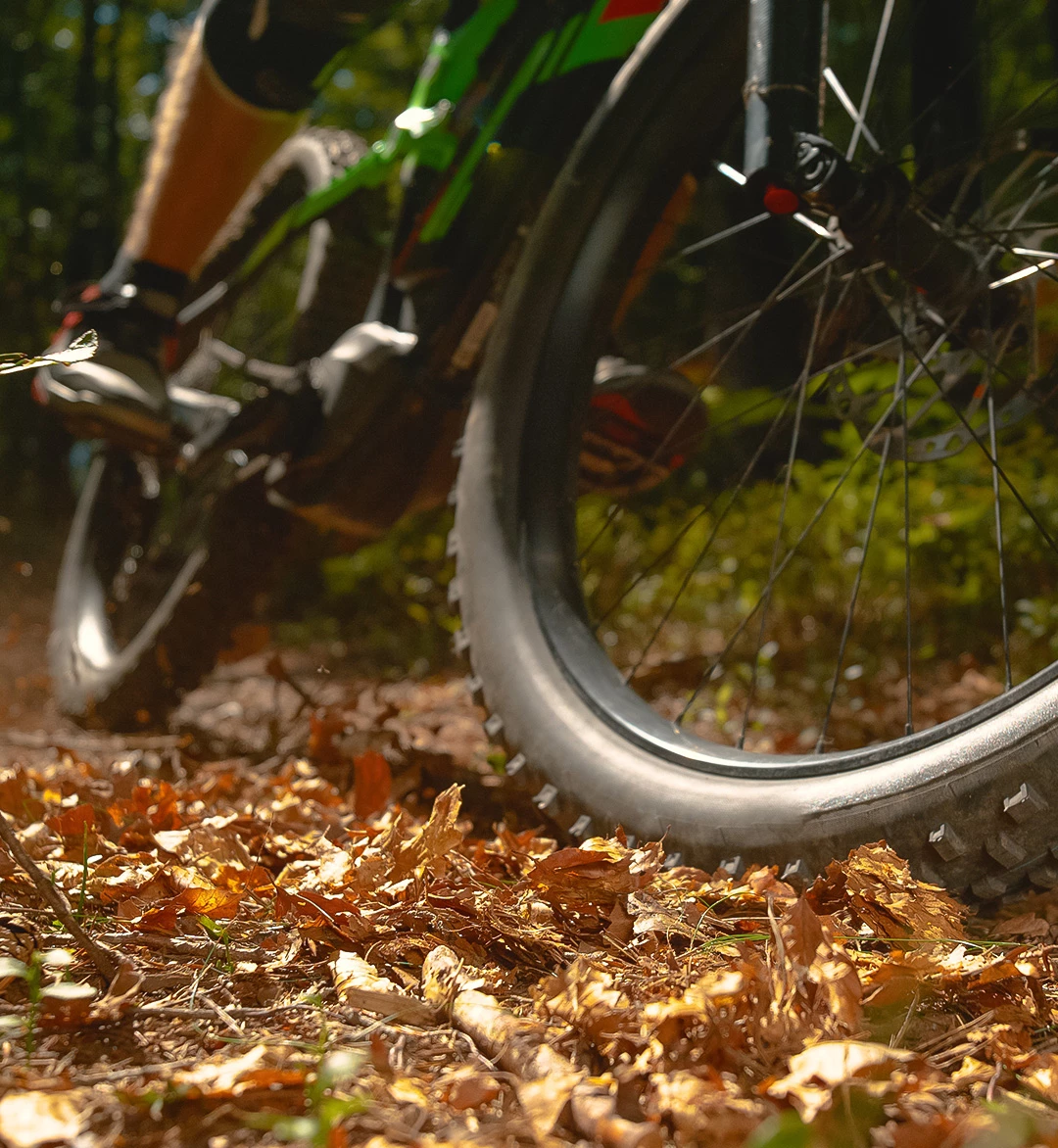 a person riding a bike on a trail