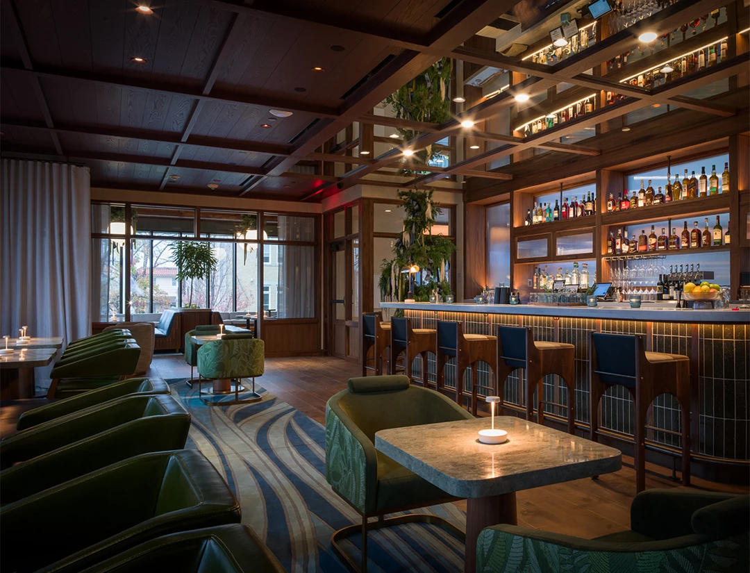 a room with a bar and chairs