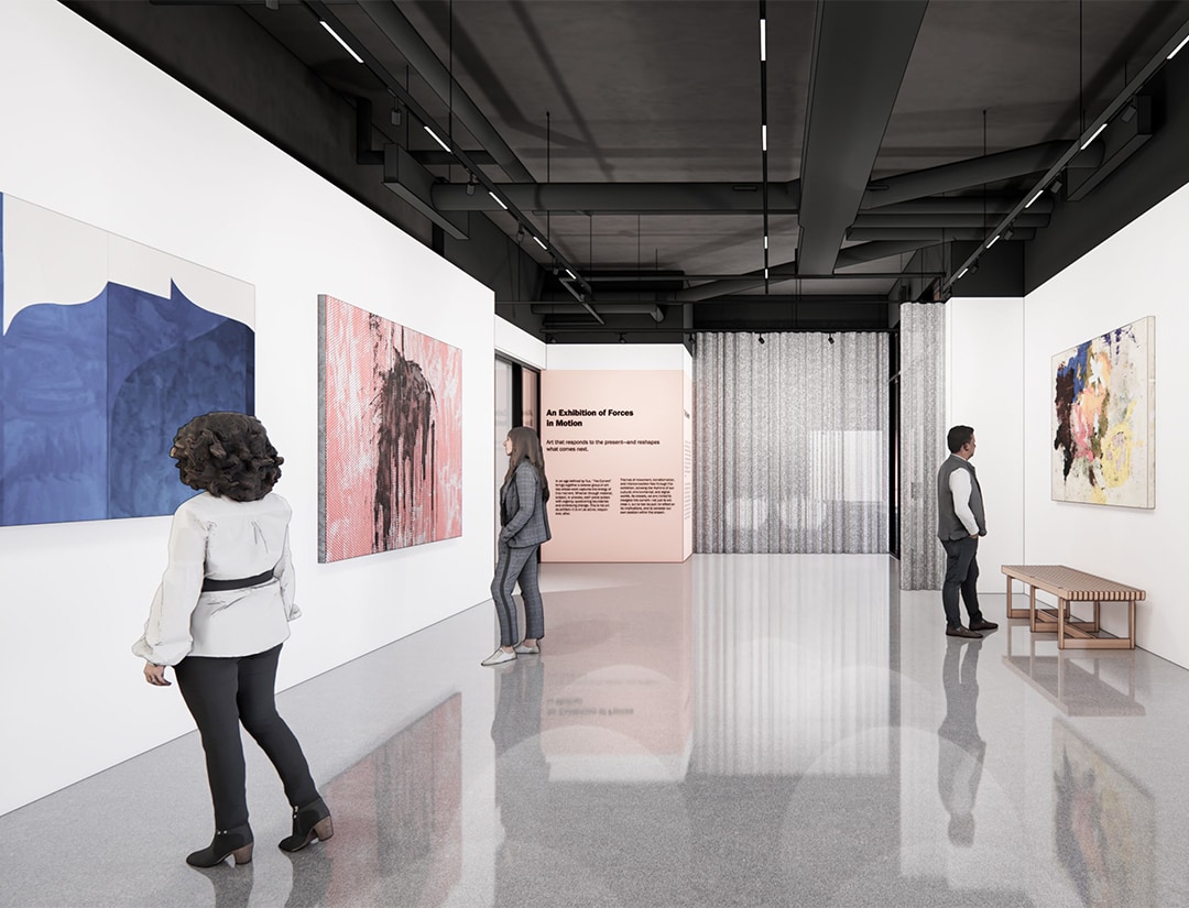 people in a room with paintings on the wall