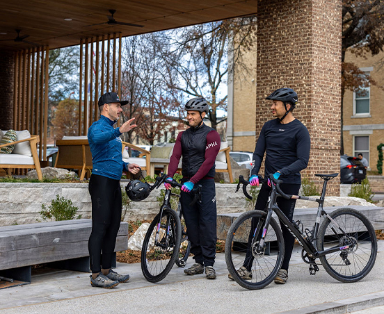 a group of men with bicycles