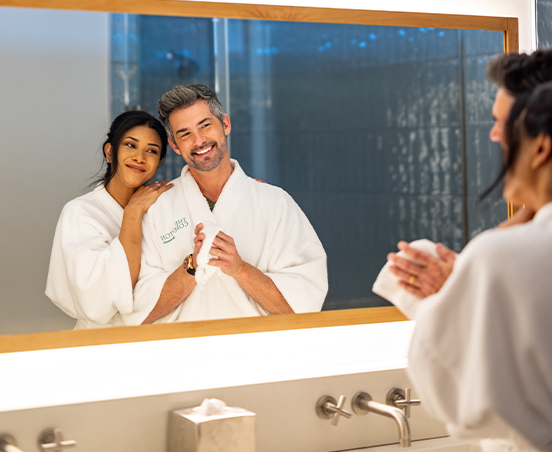 a man and woman in a bathroom