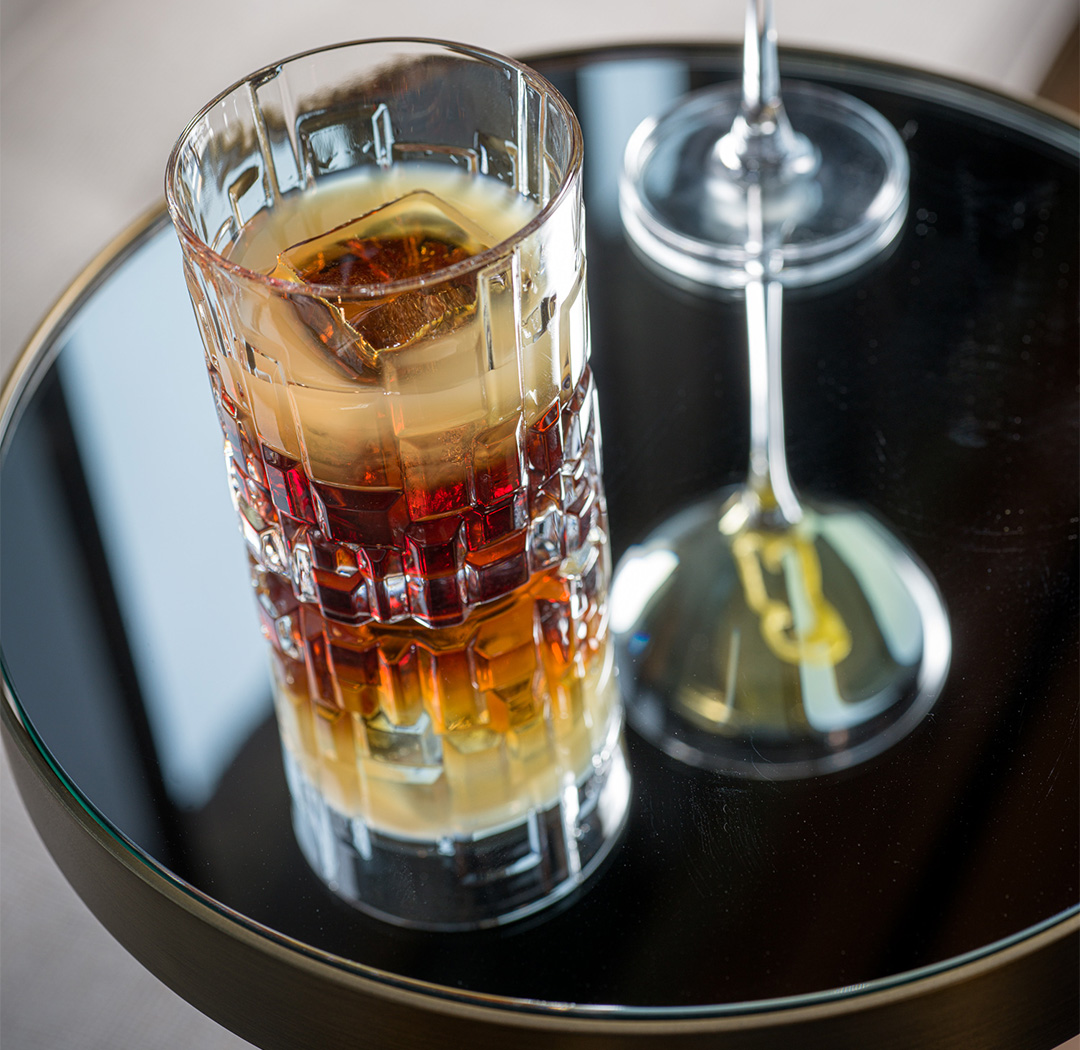 a glass of liquid on a table