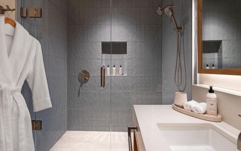 a bathroom with a shower and a sink