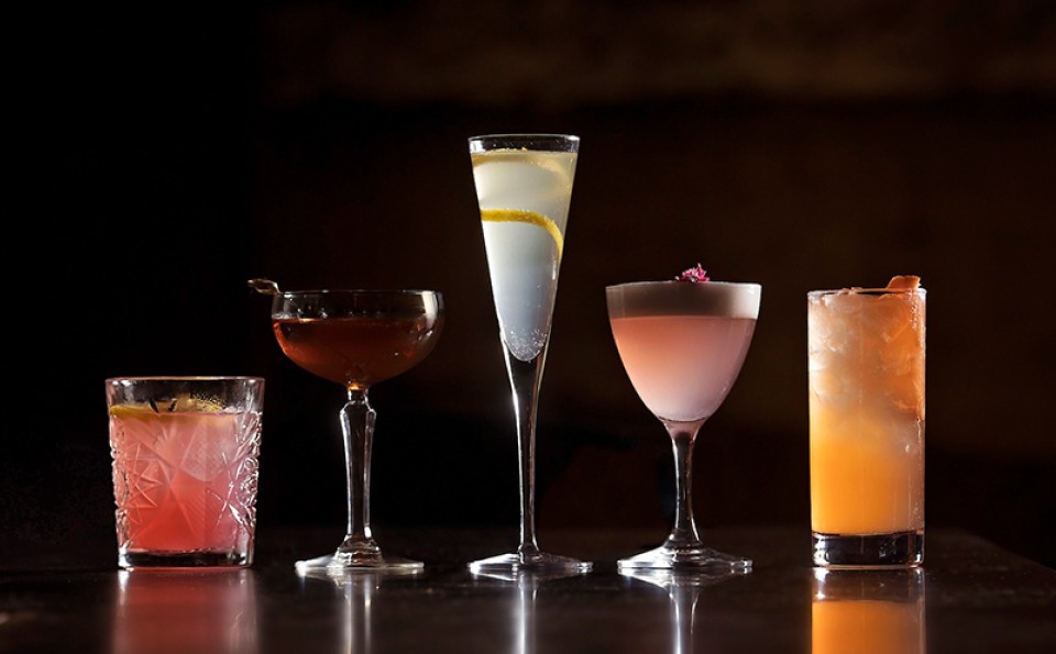 a group of different colored drinks