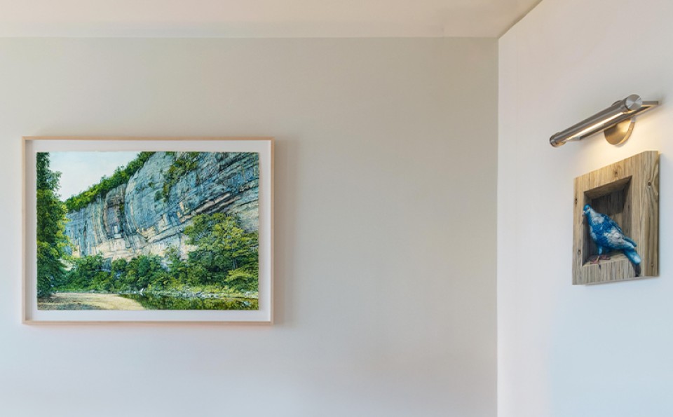 a framed painting on a wall