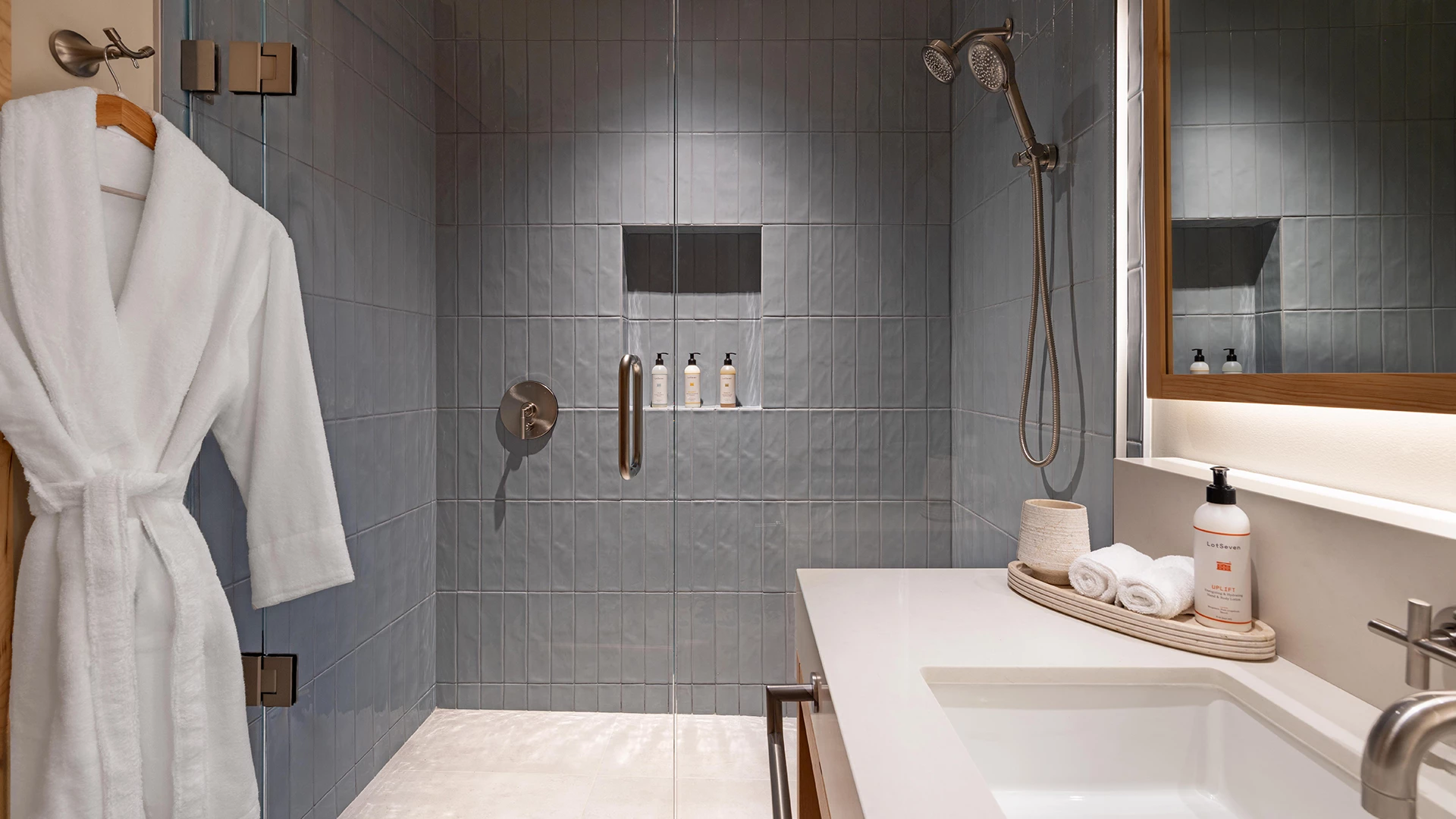 a bathroom with a shower and a sink