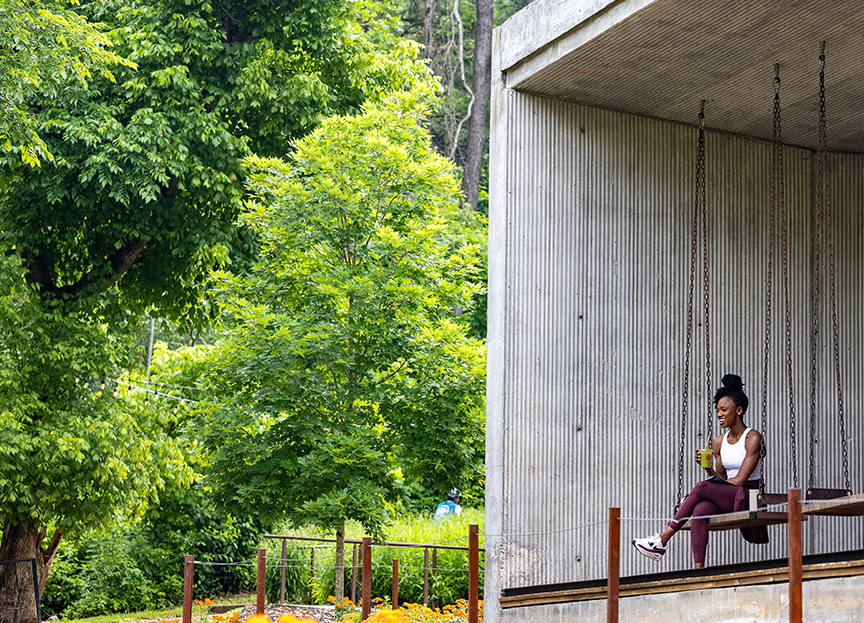 a woman sitting on a swing