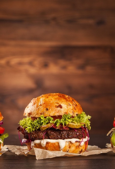 Front view of three tasty hamburgers 
