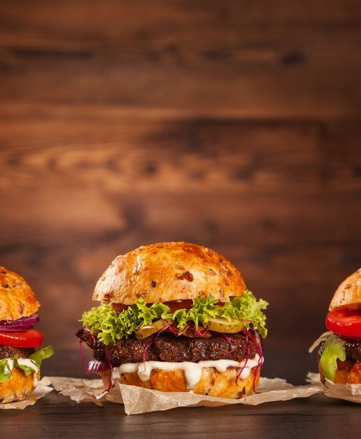 Front view of three tasty hamburgers 