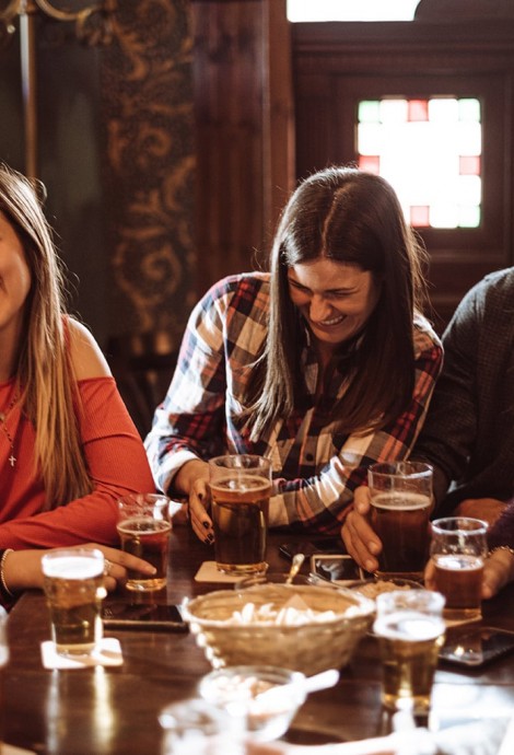 View of a group of friends drinking beer and having a good time