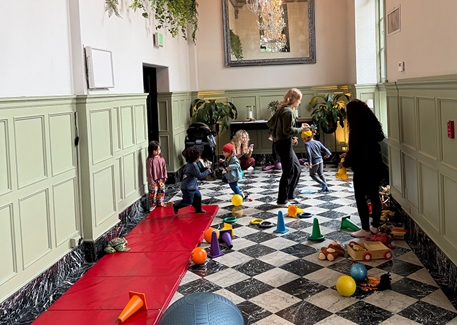 a group of children playing in a room