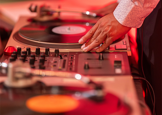 a person playing a record on a turntable