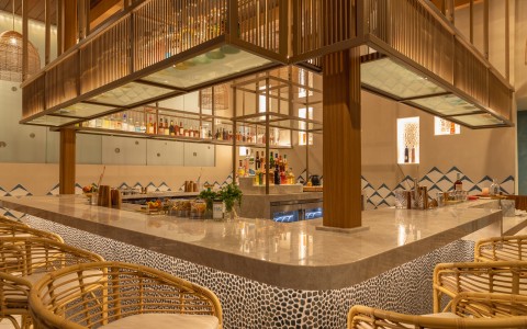 a bar with chairs and a counter