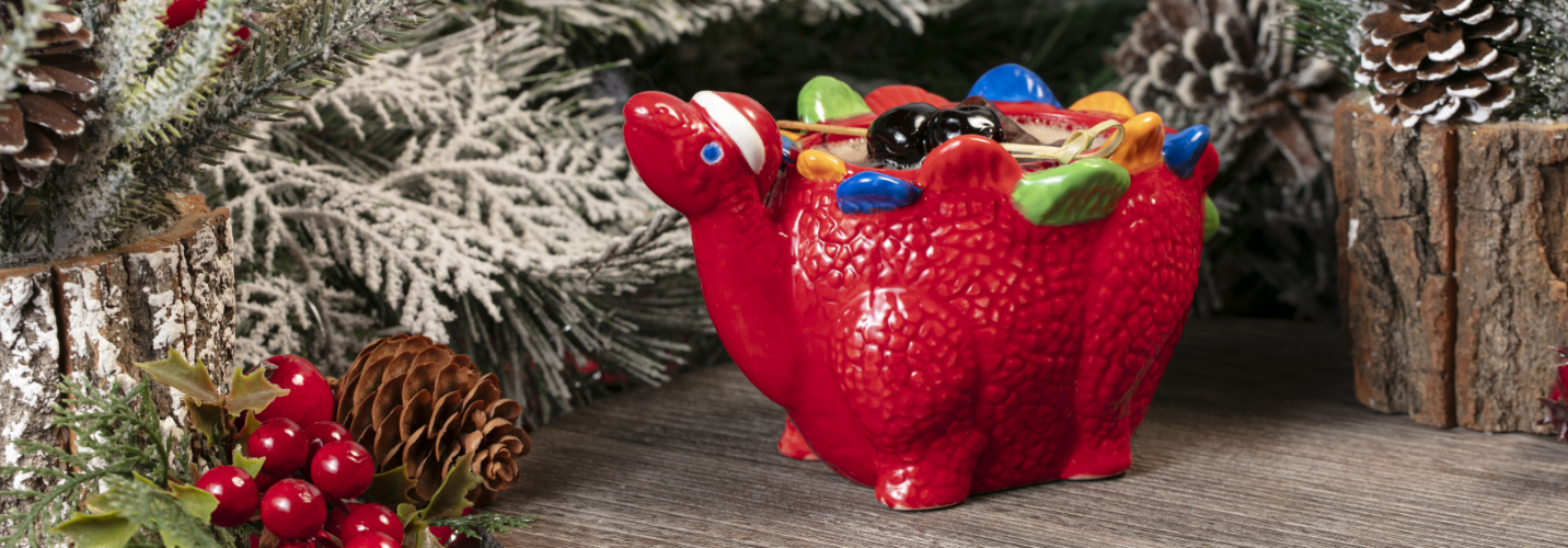 a red camel shaped object with a pine cone