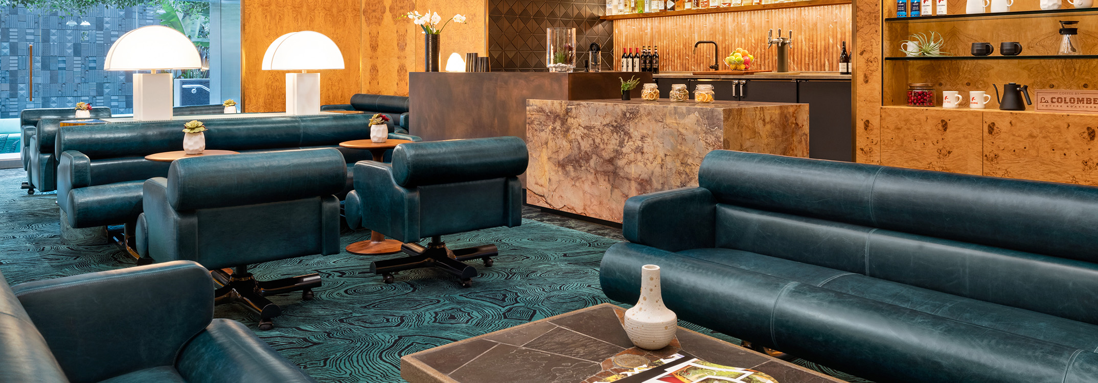 a room with blue chairs and a table